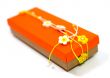 orange gift box with decoration