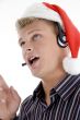 american man wearing headphone and santa hat