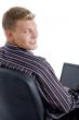 smart guy with laptop looking at camera