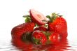 Ripe juicy strawberry in water