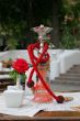 Hookah and red rose in vase