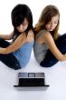 girls looking to laptop