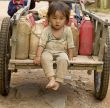Child with gasoline can