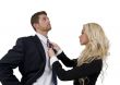 lady knotting tie of man