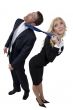female pulling tie of businessman