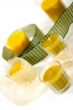 five yellow candles and ribbon