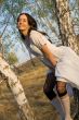 beauty girl sit on the birch tree