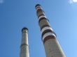 Two chimneys on the cloudy sky
