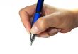 Human lady hand signing with a pen isolated over white background