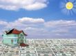 A 3D concept house on money and blue sky background