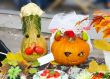 helloween vegetables pumpkin composition concept on autumn leaves and a carpet background