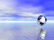 abstract glass globe over blue ocean and sunset