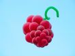 Sheaf of balloons in the form of grapes cluster against the blue sky