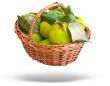 Wicker basket with quince and leaves isolated over white background