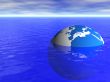 planet earth globe floating in blue ocean and cloudy sky background