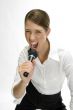 businesswoman singing into microphone