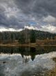 Heavy sky reflexion in dark lake