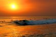 Surfers with Sunset