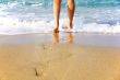 Woman`s legs, going to sea