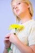 Blond Woman with a Bright Yellow Flower