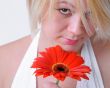 Blond Woman with a Bright Orange Flower