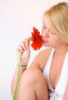 Blond Woman with a Bright Orange Flower