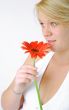 Blond Woman with a Bright Orange Flower