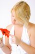 Blond Woman with a Bright Orange Flower