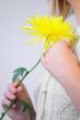 Blond Woman with a Bright Yellow Flower