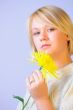 Blond Woman with a Bright Yellow Flower
