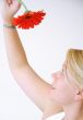 Blond Woman with a Bright Orange Flower