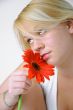 Blond Woman with a Bright Orange Flower