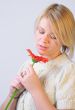 Blond Woman with a Bright Orange Flower
