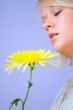 Blond Woman with a Bright Yellow Flower