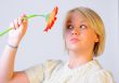 Blond Woman with a Bright Orange Flower