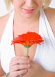 Blond Woman with a Bright Orange Flower