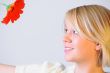 Blond Woman with a Bright Orange Flower