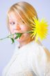 Blond Woman with a Bright Yellow Flower