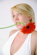 Blond woman with an Orange Flower