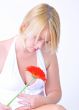 Blond woman with an Orange Flower