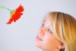 Blond woman with an Orange Flower