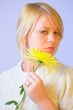Blond Woman with a Bright Yellow Flower
