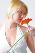 Blond woman with an Orange Flower