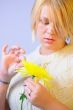 Blonde Woman with a Bright Yellow Flower
