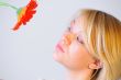 Blond woman with an Orange Flower