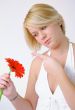 Blond woman with an Orange Flower