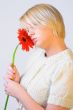 Blond woman with an Orange Flower