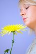 Blond Woman with a Bright Yellow Flower