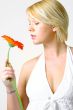 Blond woman with an Orange Flower