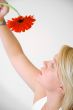 Blond Woman with a Red Flower